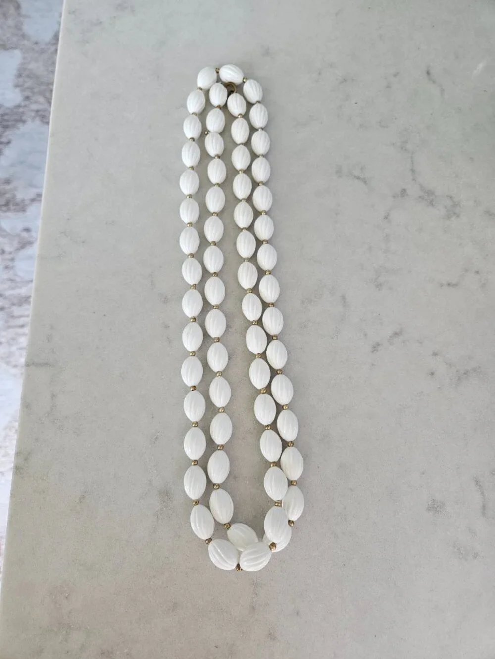 RARE AND VINTAGE WHITE RIBBED OVAL BEAD 48
